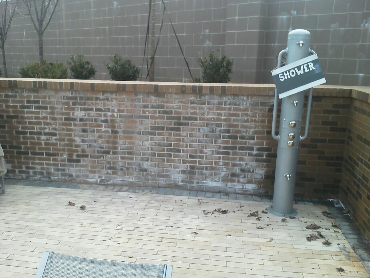 Efflorescence pool shower area - Brick